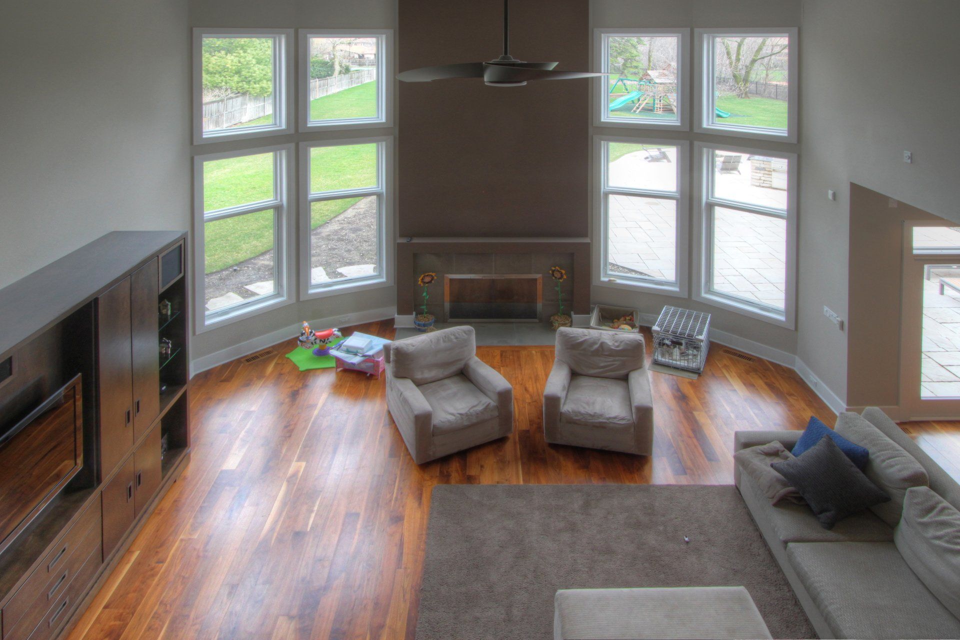 A living room with hardwood floors and a fireplace