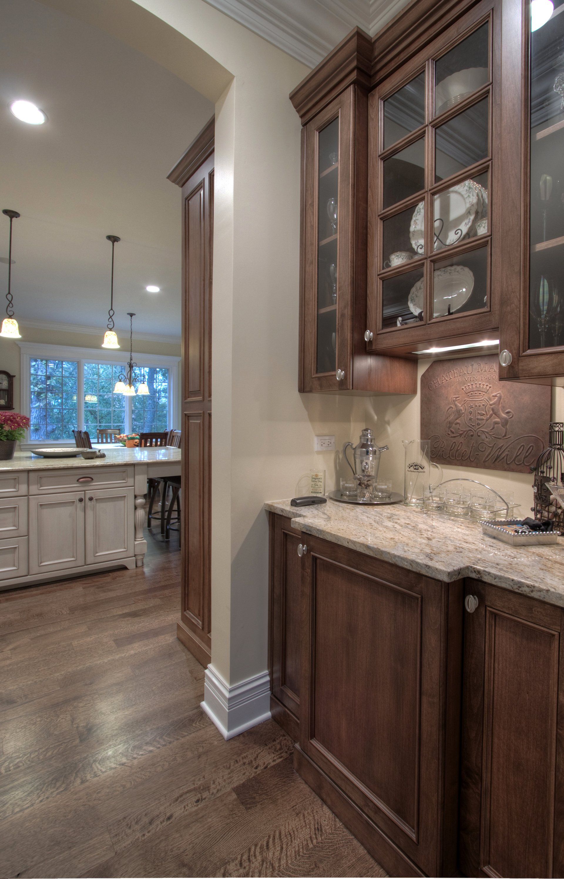 A kitchen with wooden cabinets and granite counter tops