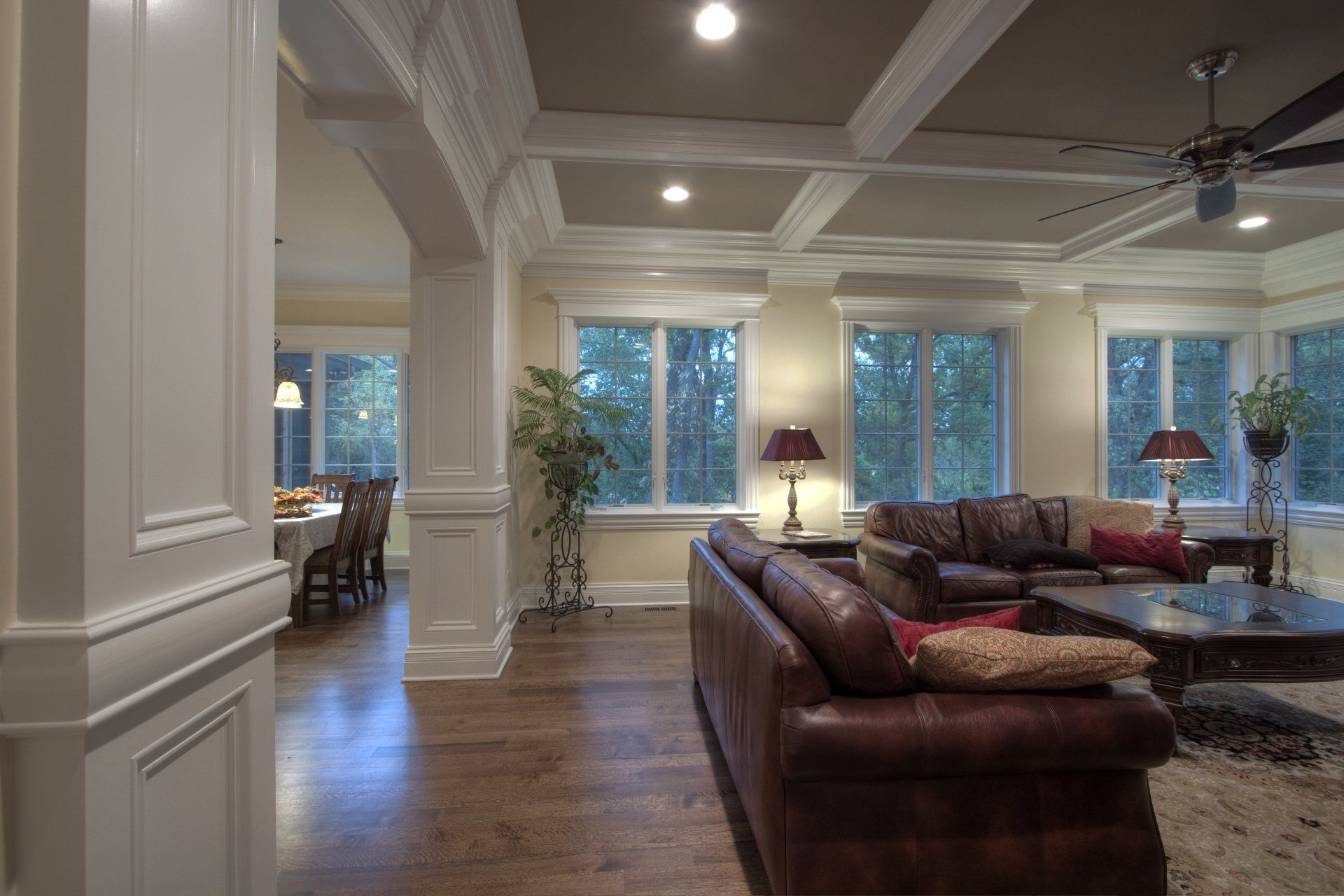 A living room filled with furniture and a ceiling fan.