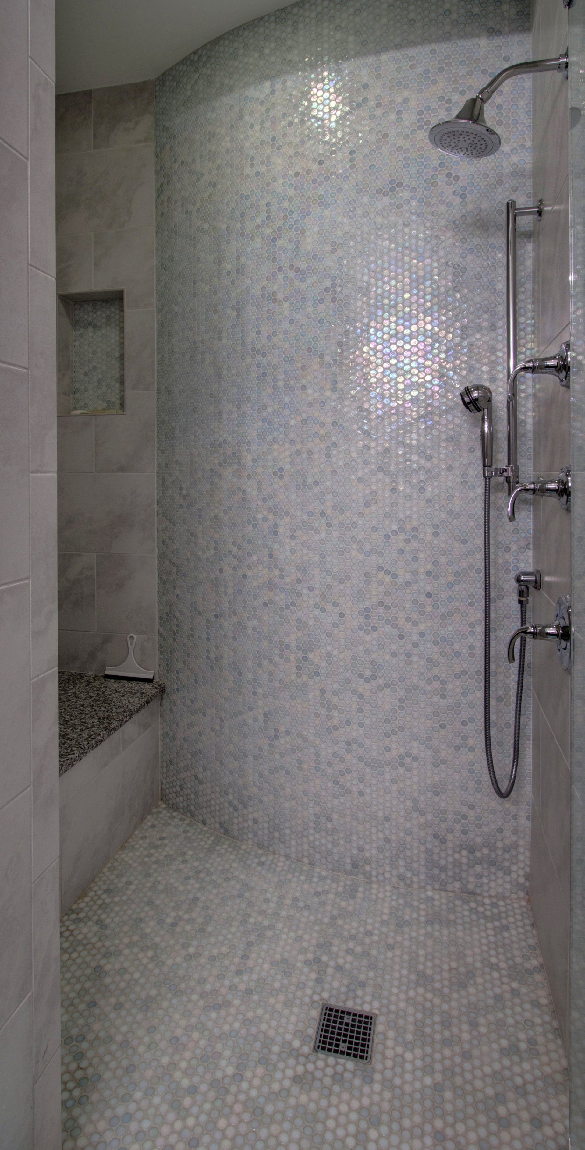A bathroom with a walk in shower and a bathtub.