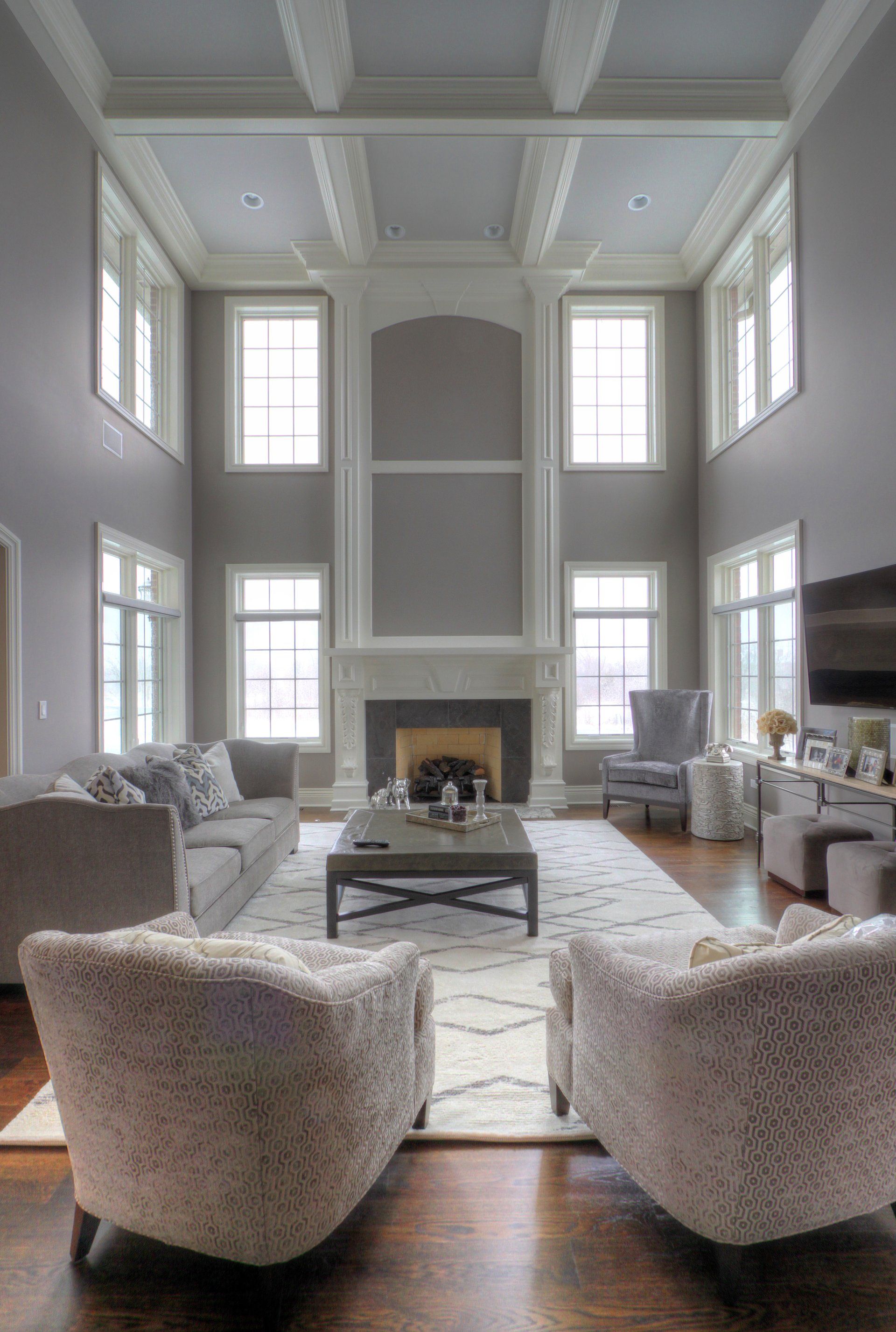 A living room filled with furniture and a fireplace.