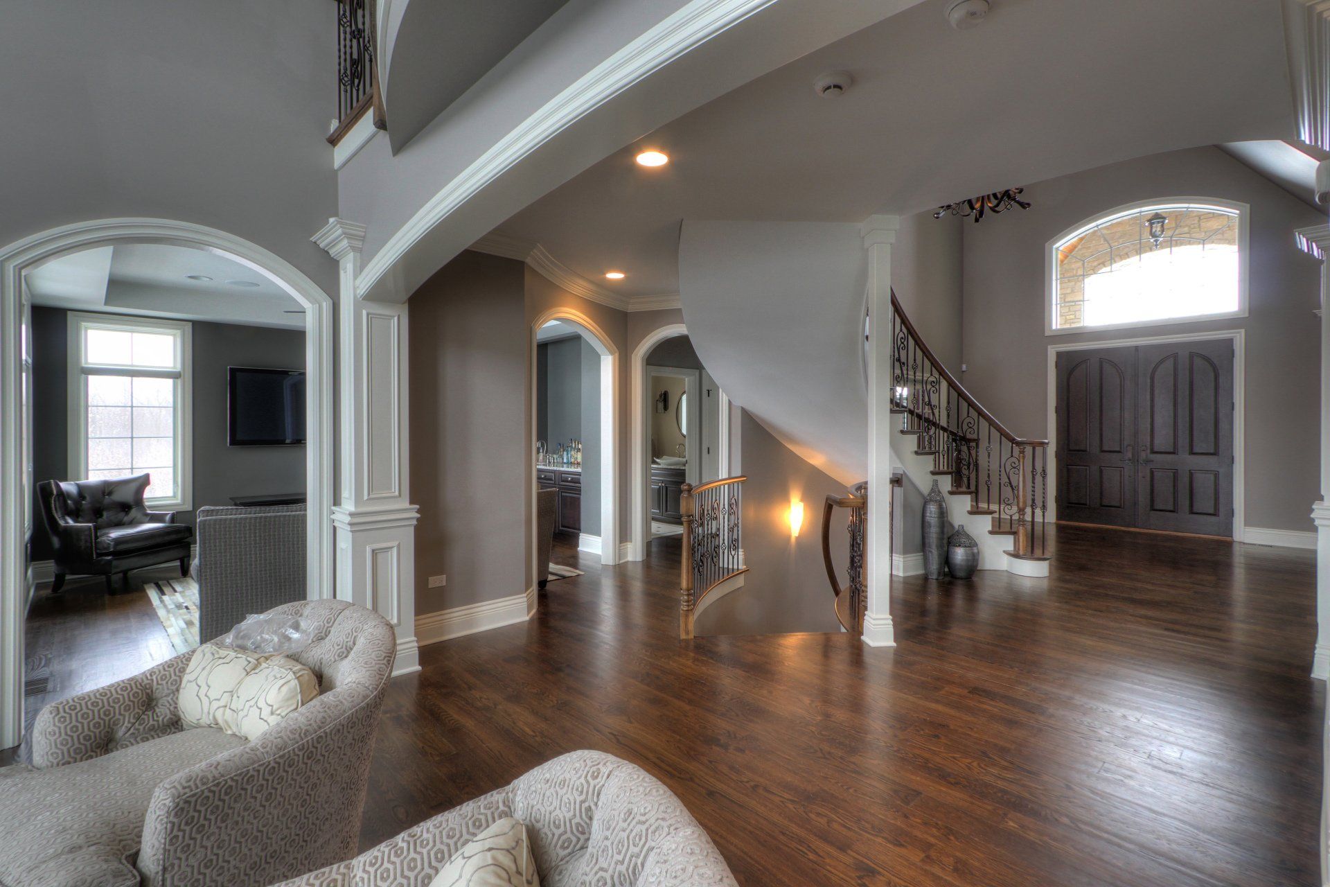 There is a staircase in the middle of the living room.