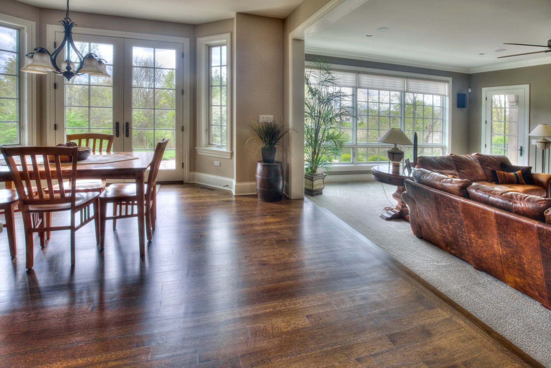 A living room with a table and chairs and a couch