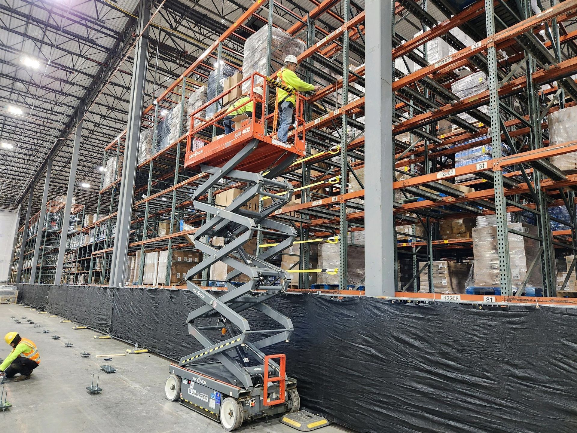 securing safety with the installation of 450 pallet rack safety straps and netting. 