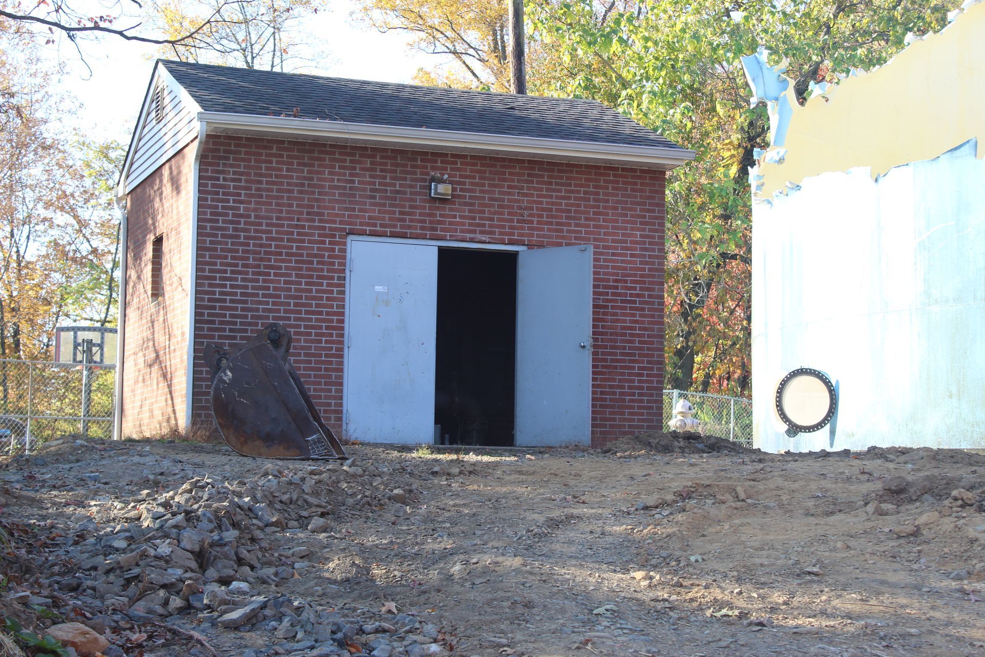 The booster pump building next to the steel water tank to be demolished by Empire Services.