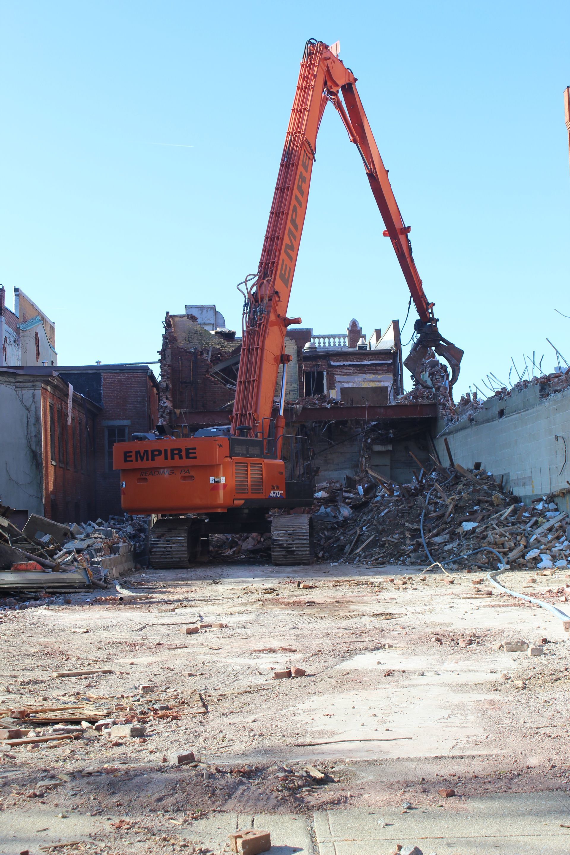 Empire Services demolishing the targeted section of the building on Penn Street. 