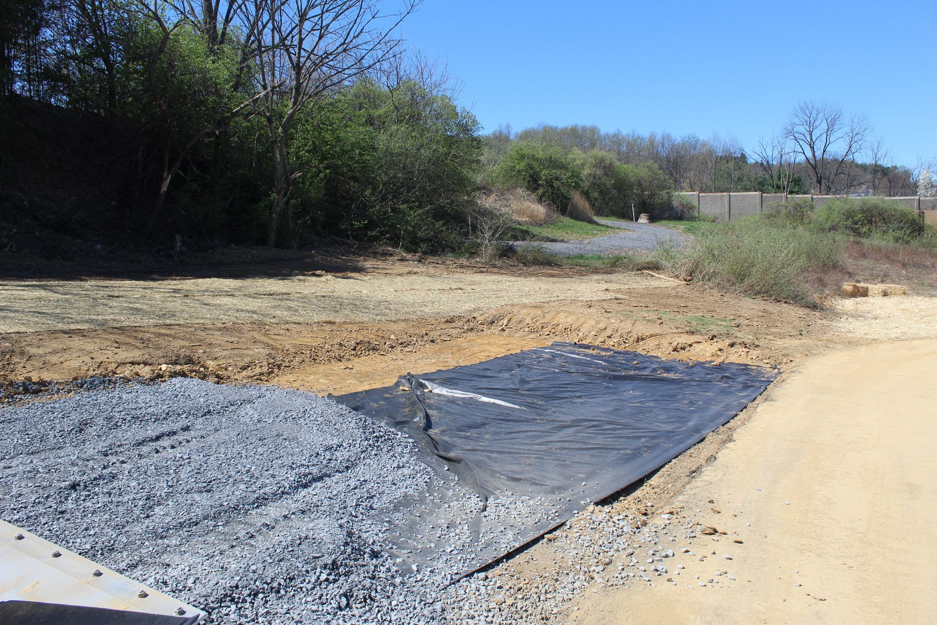Laying down the rocks to prepare for paving.