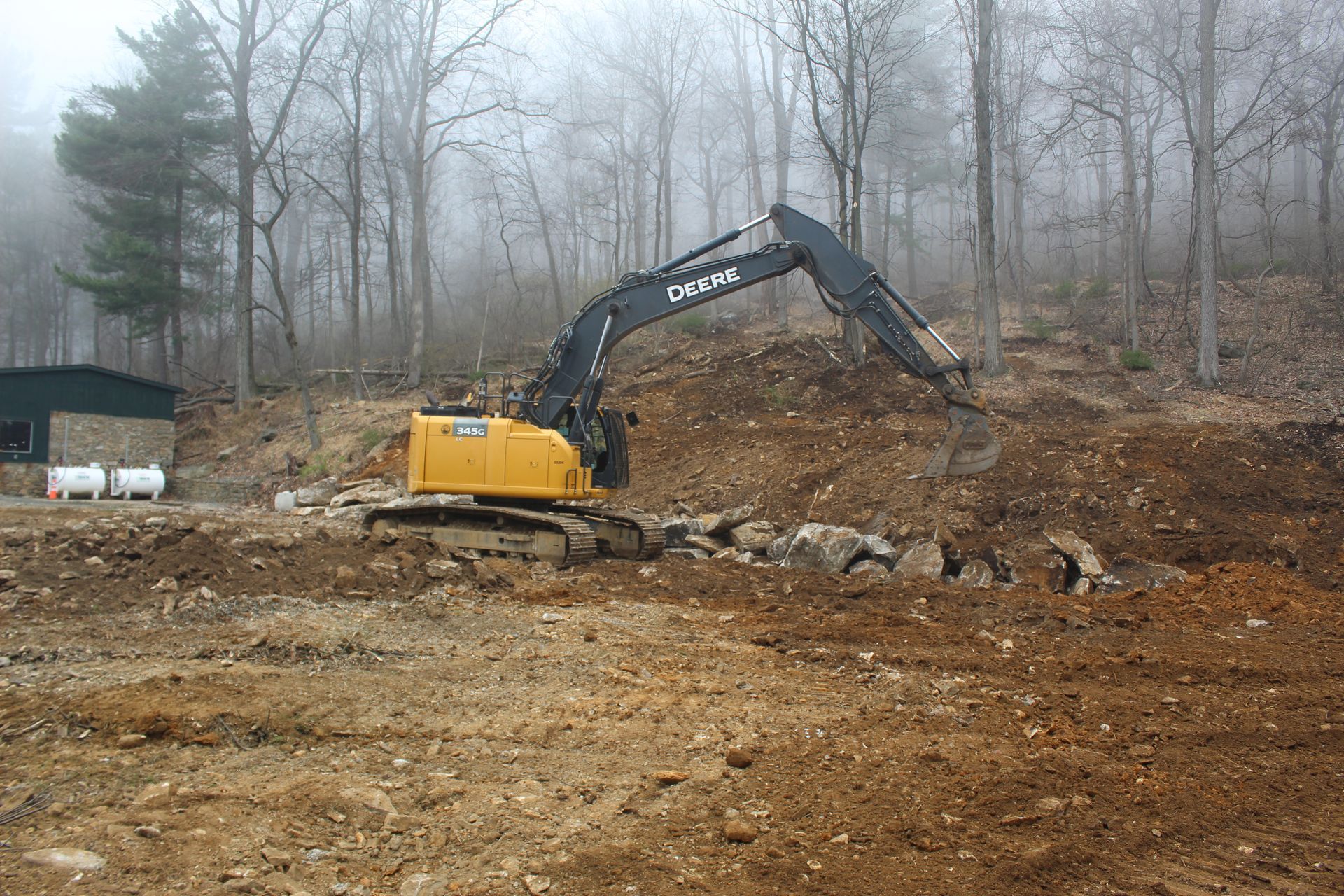 Building a barrier of boulders and rocks.