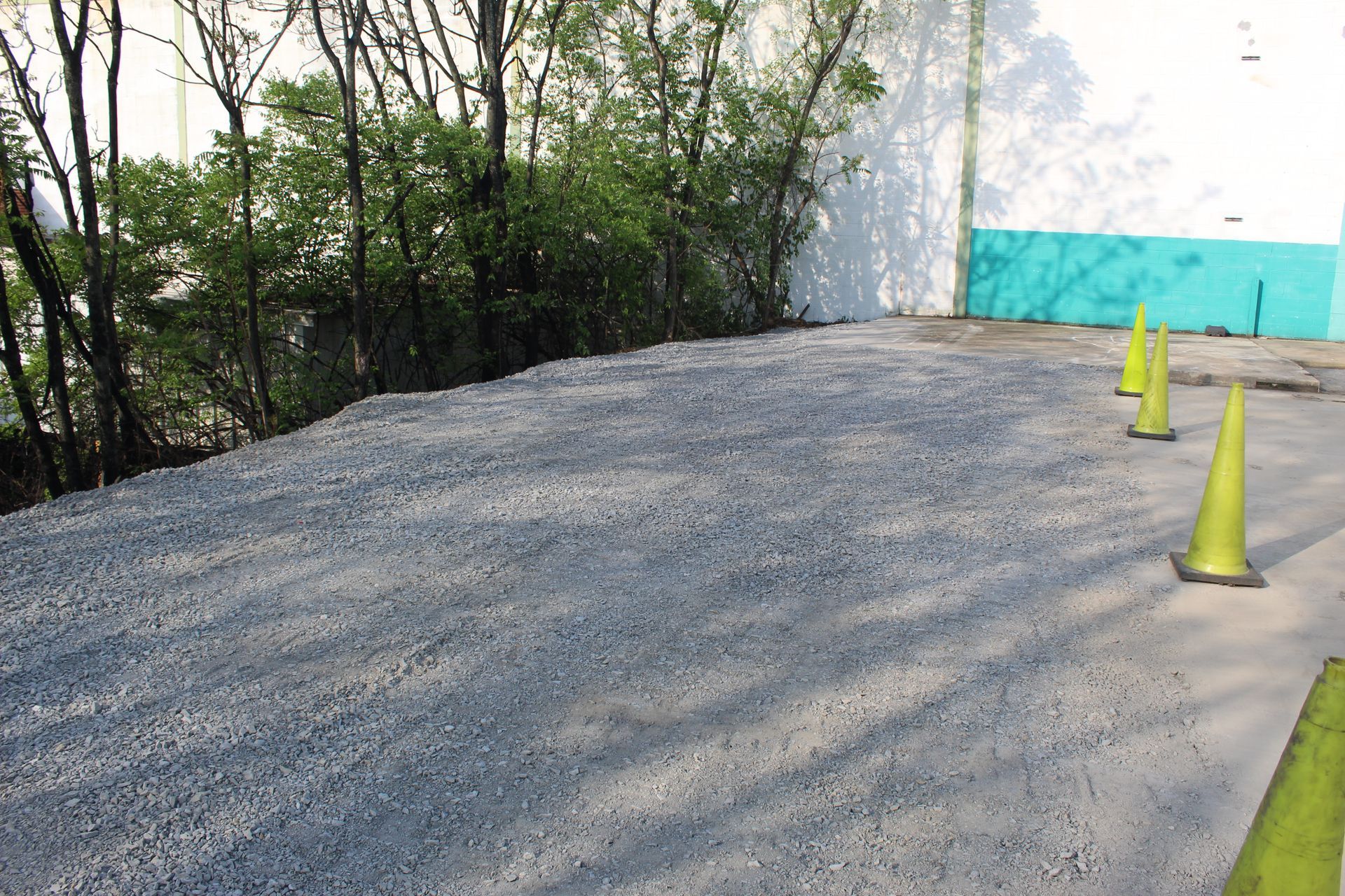 Crushed stone is spread around the site.