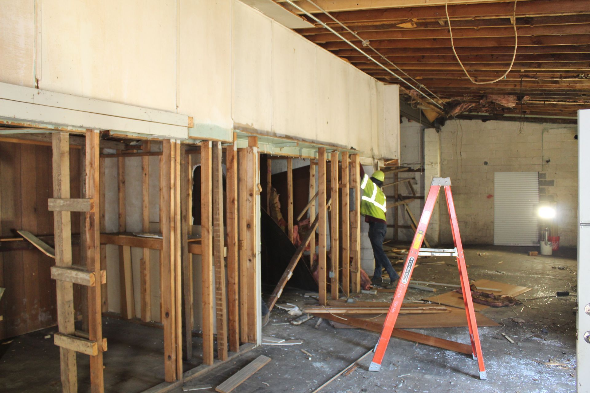 Empire Services team providing select demolition in the interior of the garage.