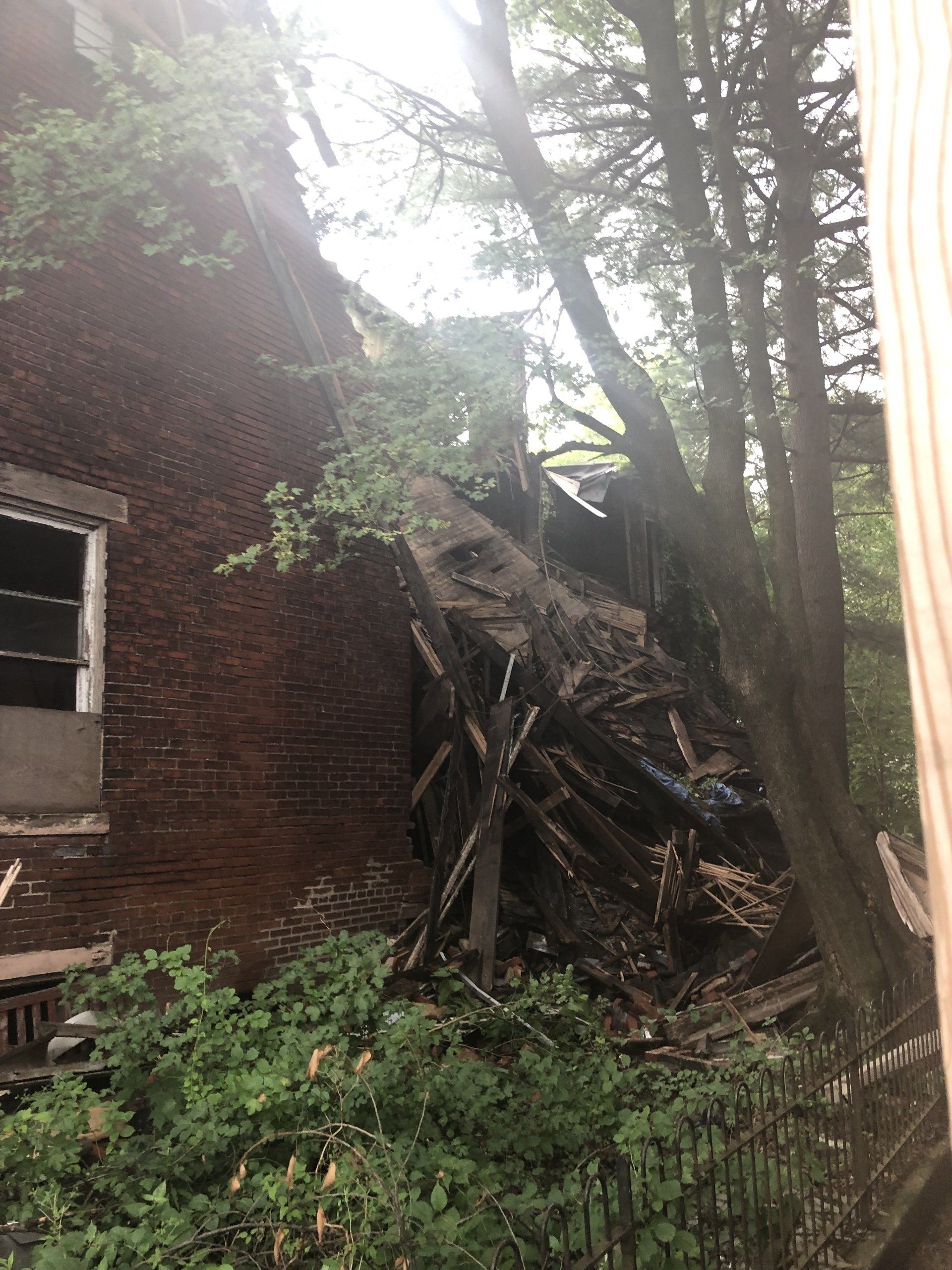 Middle of structure collapsed from the roofline down to water filtration.