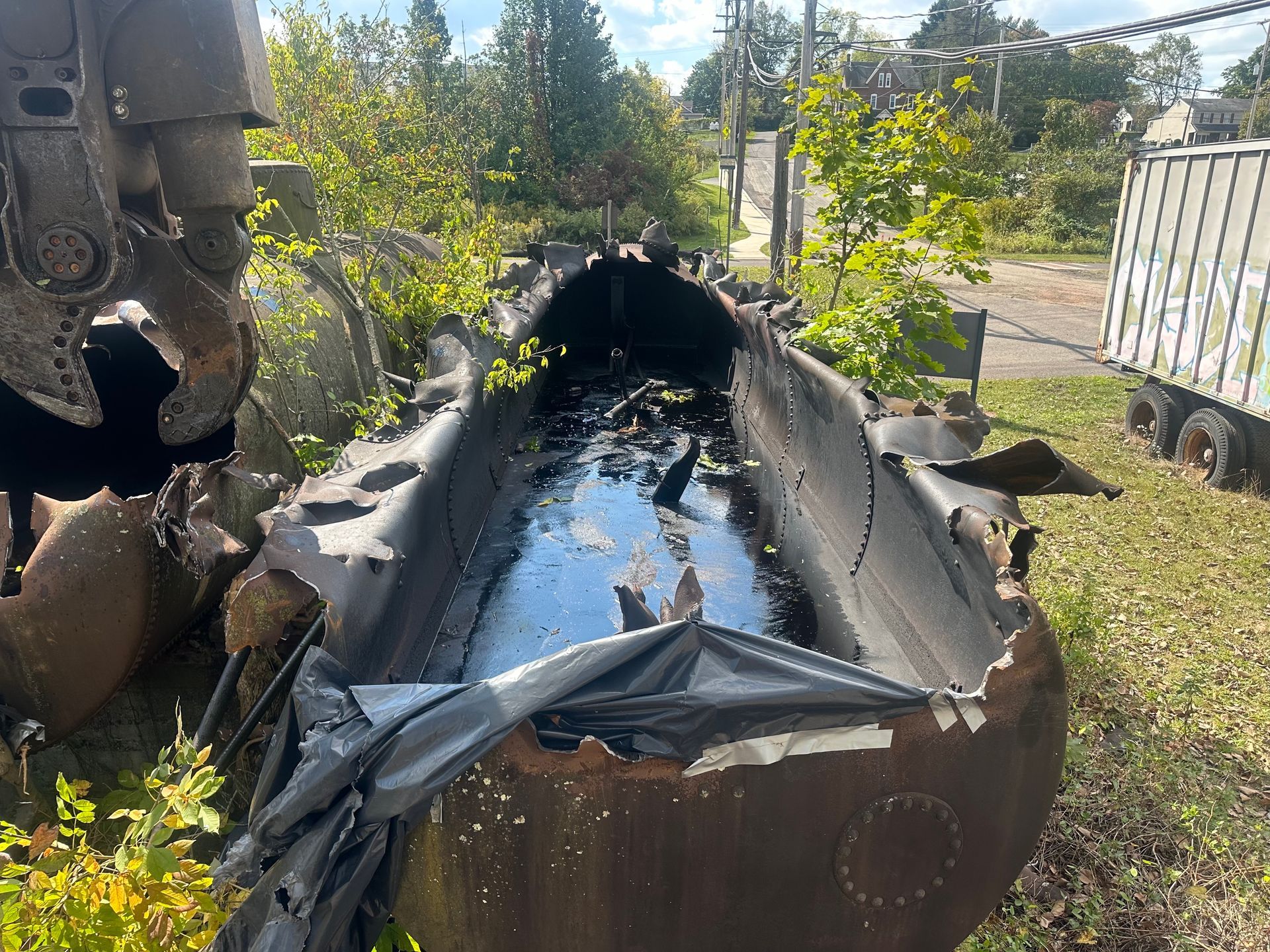 One of the above ground storage tanks with residual waste.
