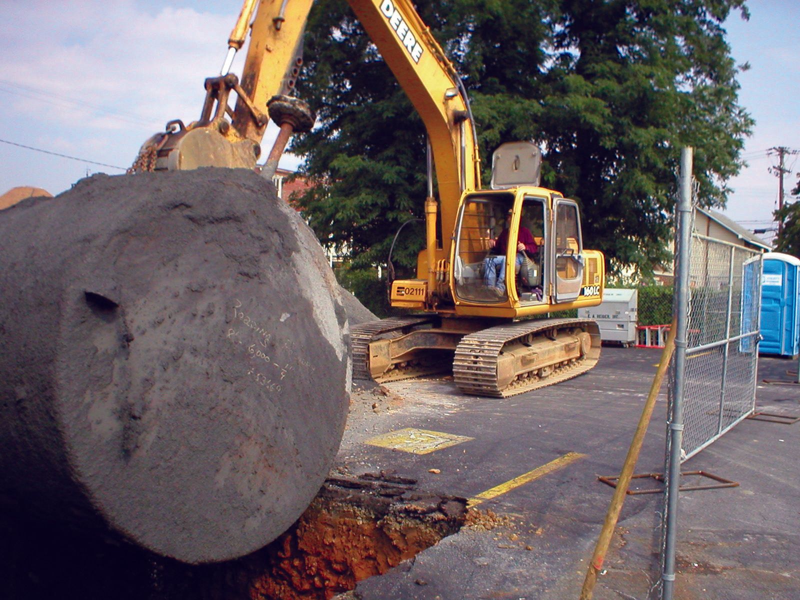 A yellow excavator with the word general on it