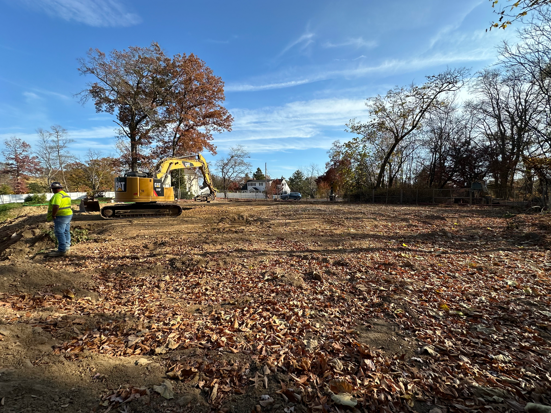 After shot of water tank, booster pump house and piping by Empire Services. 