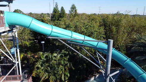 Restored waterslide surface with fresh gelcoat application