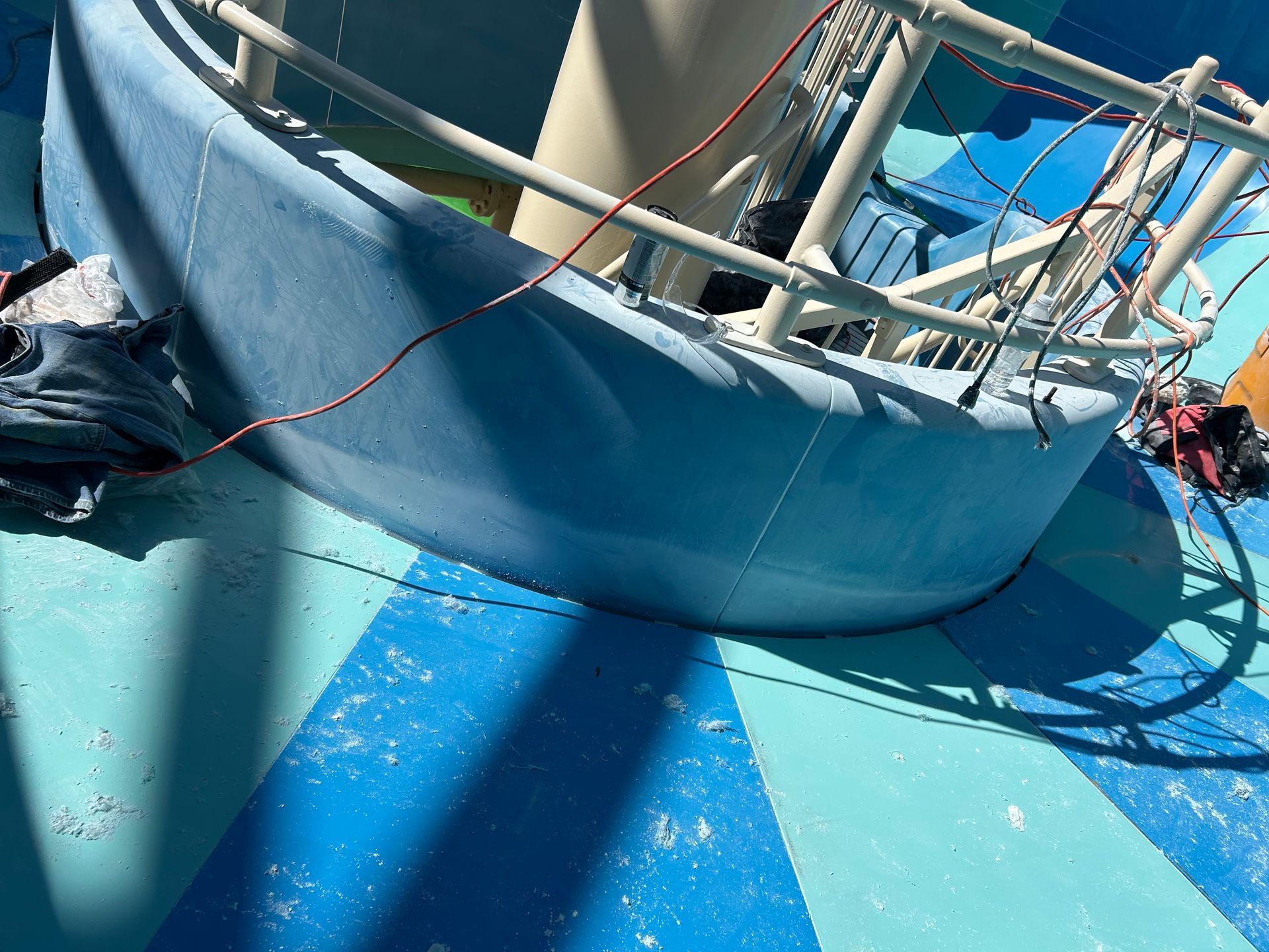 On-site fiberglass repair and gelcoat resurfacing in progress on a waterpark slide