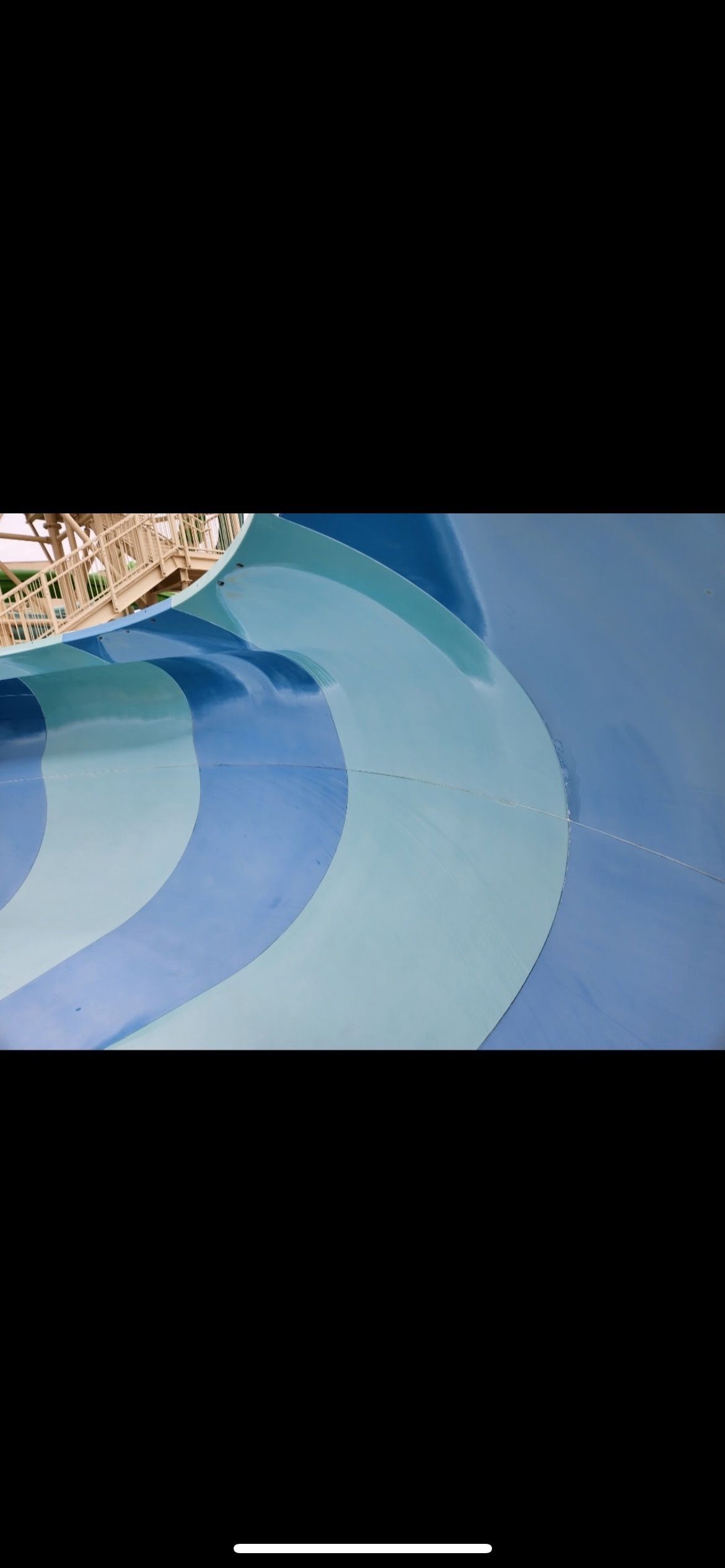 Waterslide before gelcoat restoration showing faded colors, surface wear, and visible cracks