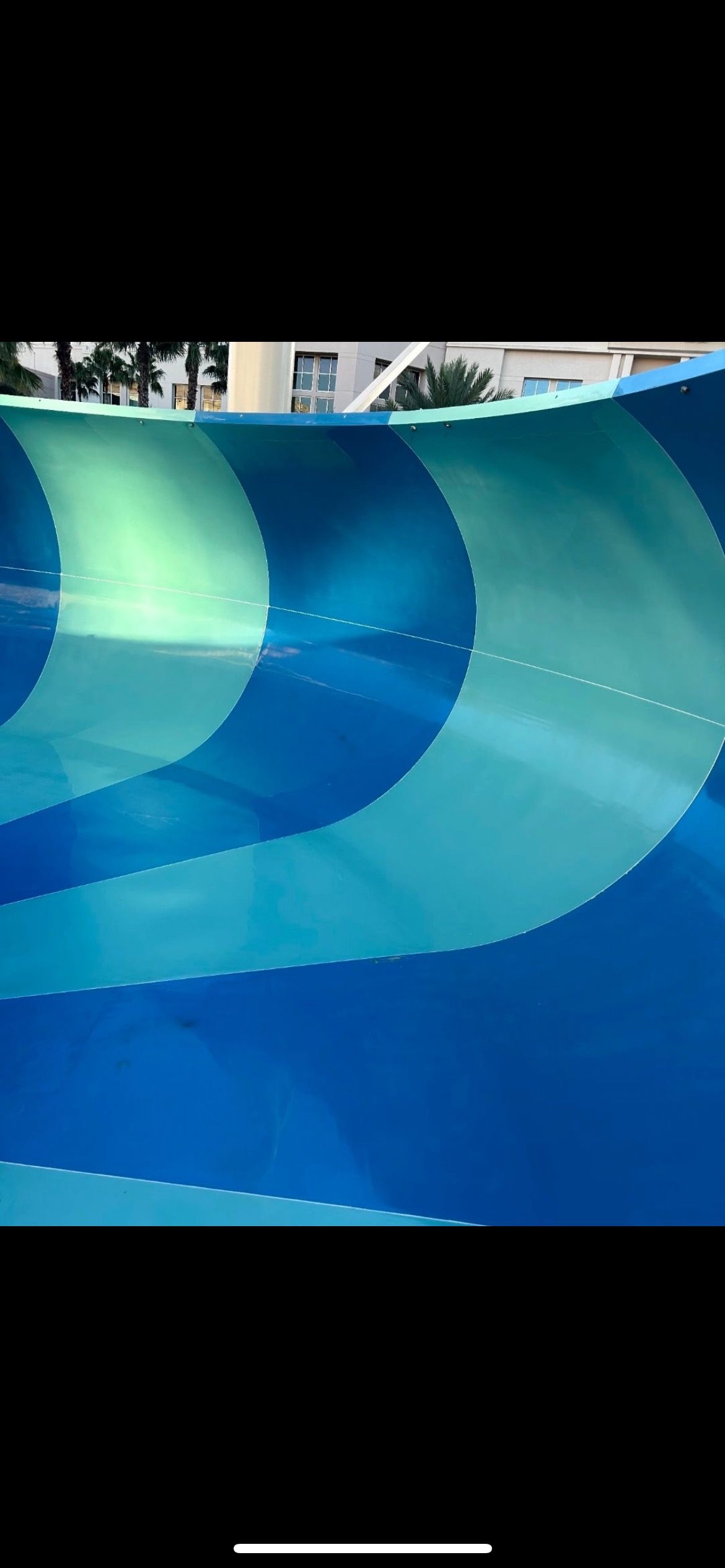 Fully restored waterslide with smooth glossy gelcoat finish and vibrant colors