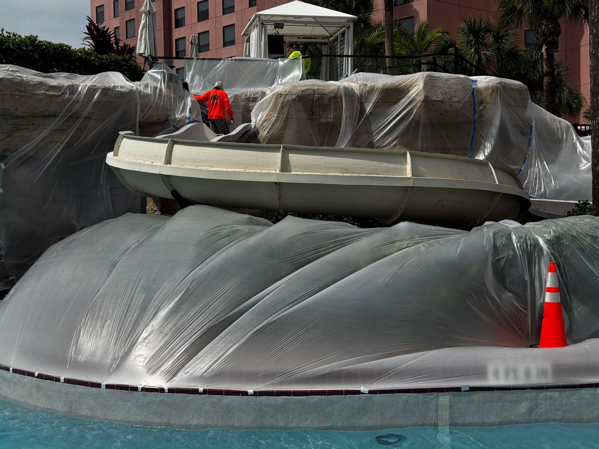 Water Slide Services: An aerial view of a water slide in a parking lot