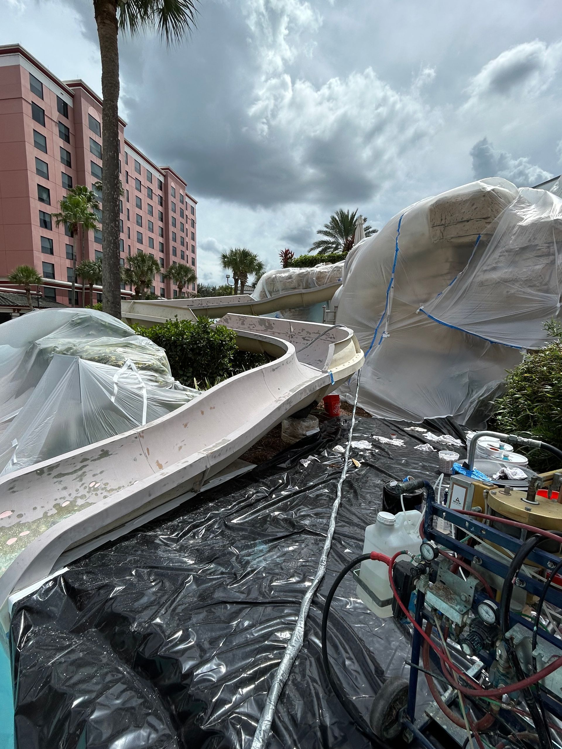 Water Slide Services: A water slide with a blue sign that says drop