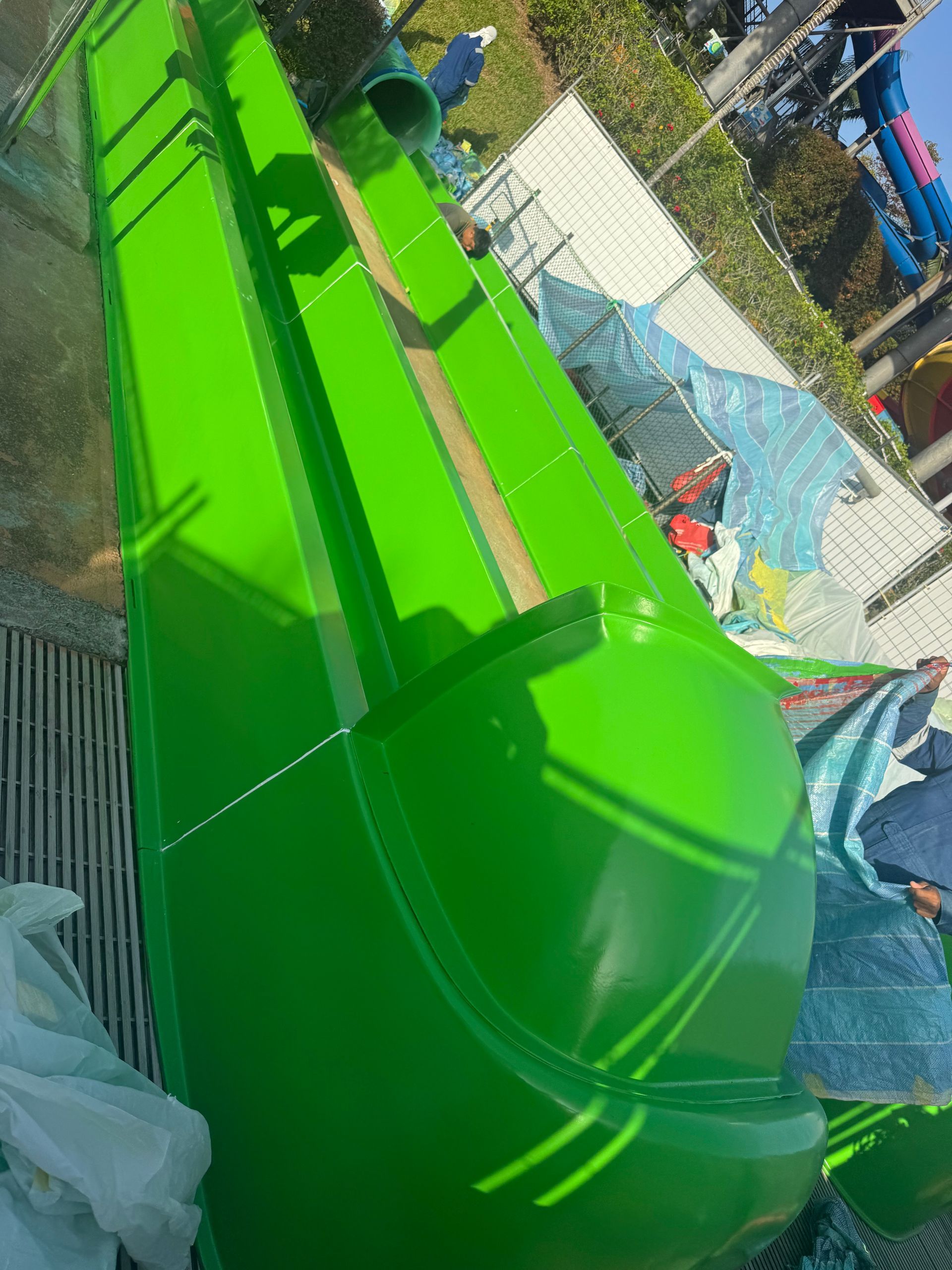 Fully restored green waterslide with vibrant high-gloss gelcoat finish at Legoland Malaysia