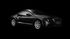 A black car is parked in the dark on a black background.