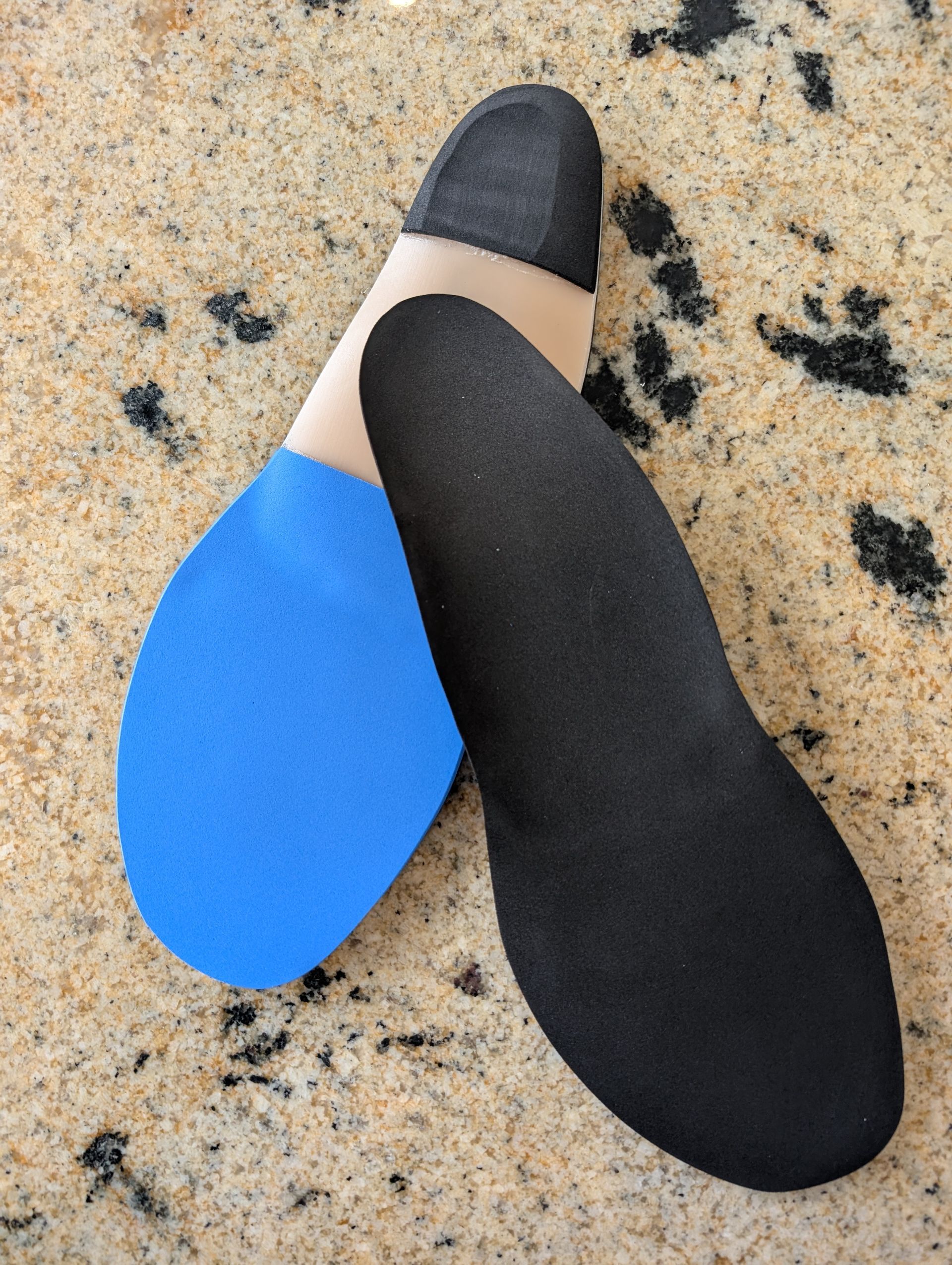 A woman is getting her wrist examined by a doctor.