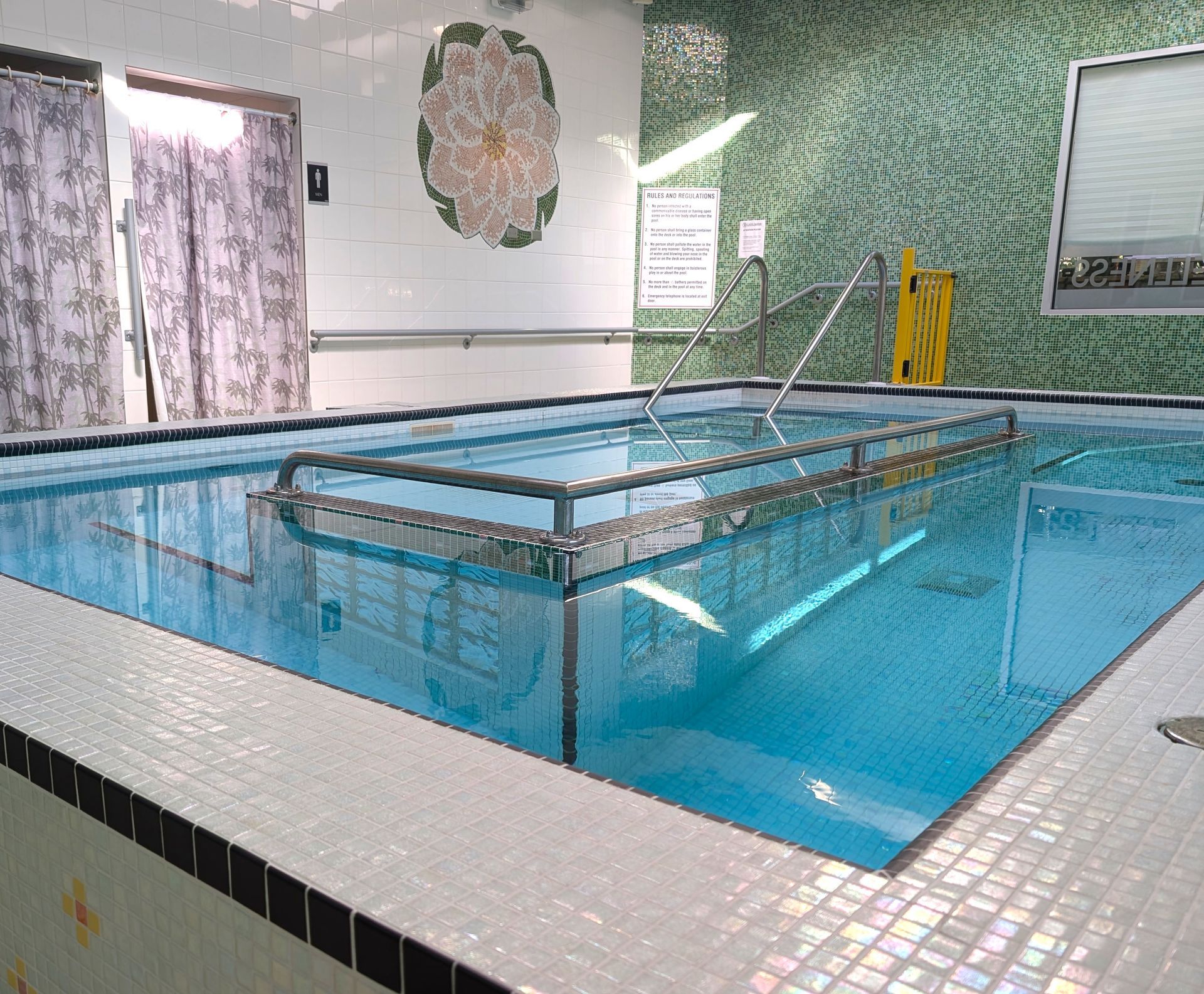 A woman is getting her wrist examined by a doctor.
