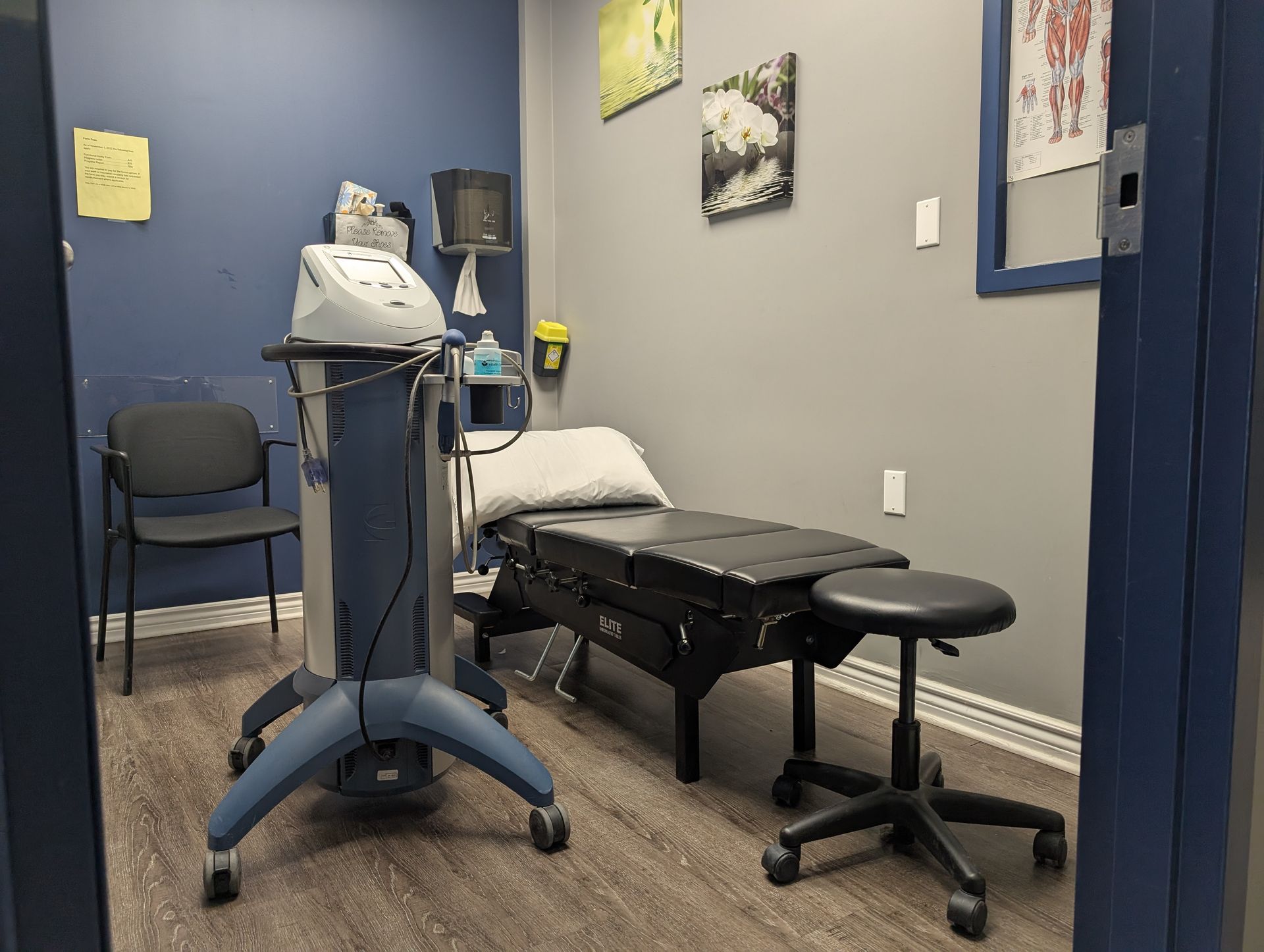 A man is wearing a posture corrector on his back.