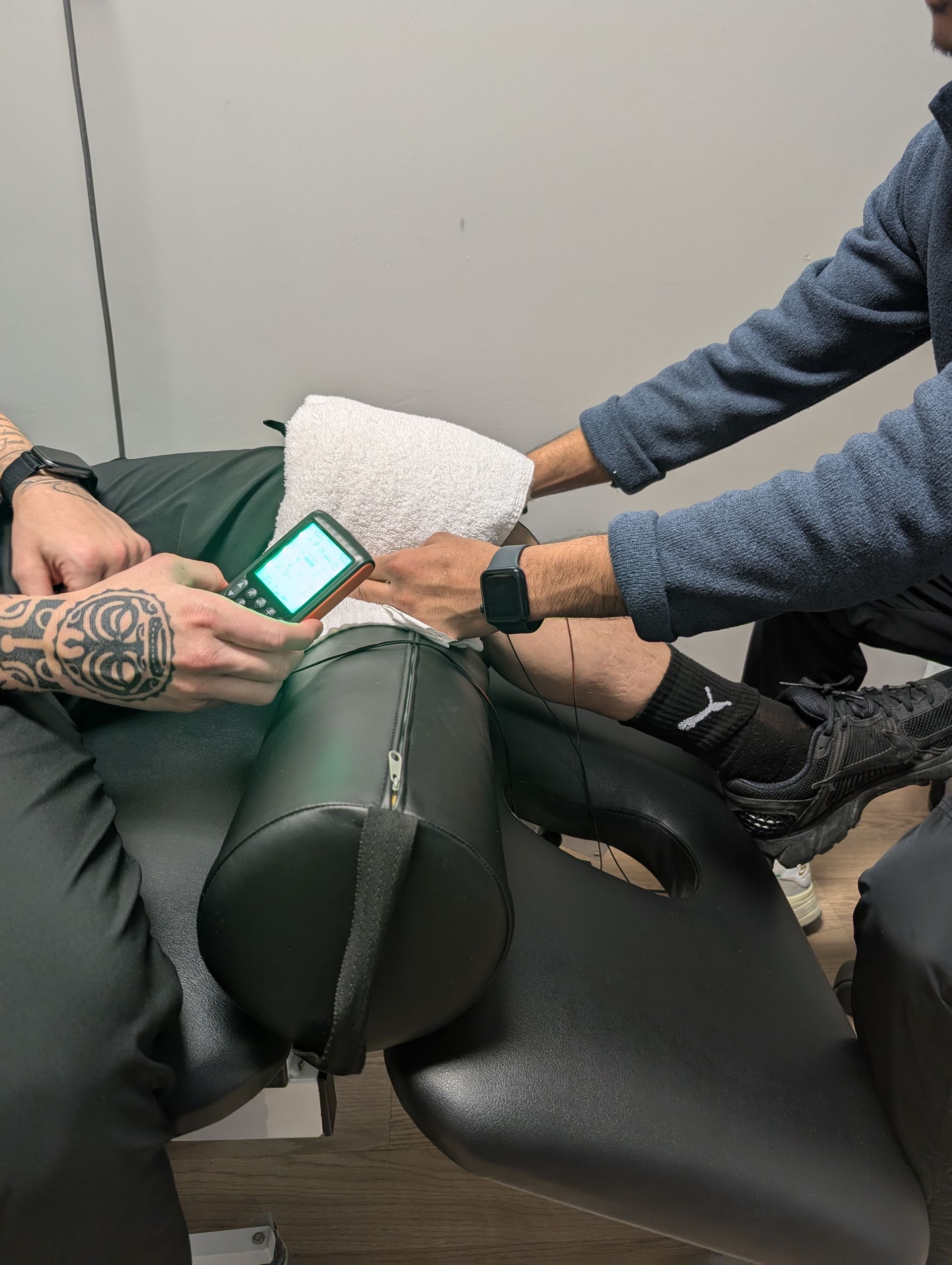 A man is wearing a posture corrector on his back.