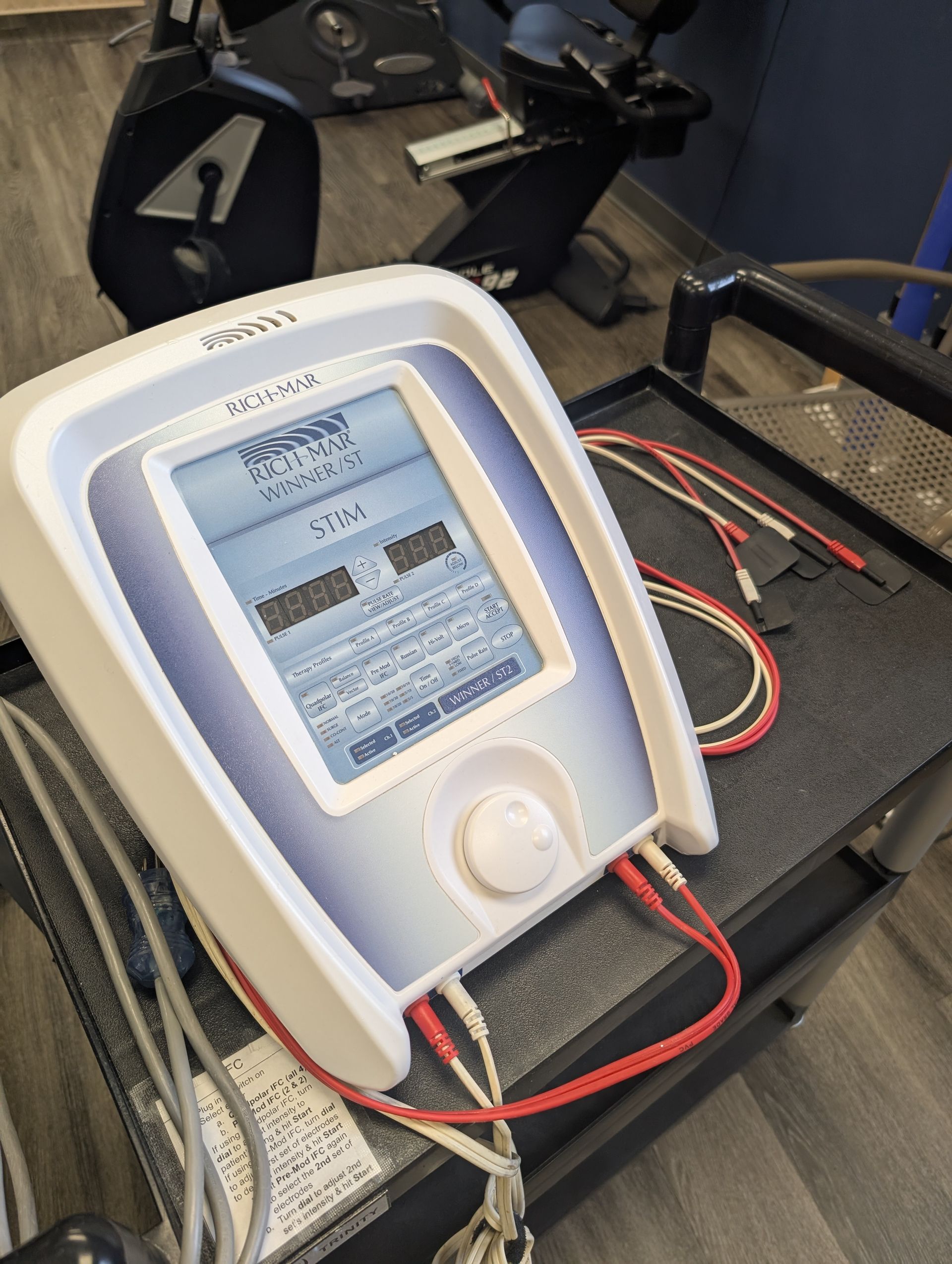 A woman is getting her wrist examined by a doctor.
