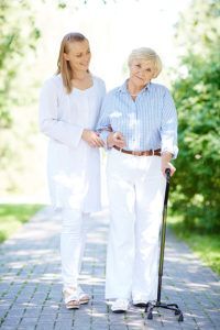 Physiotherapist Assisting Elderly Patient