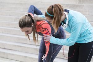 Female Athlete and Physical Therapist