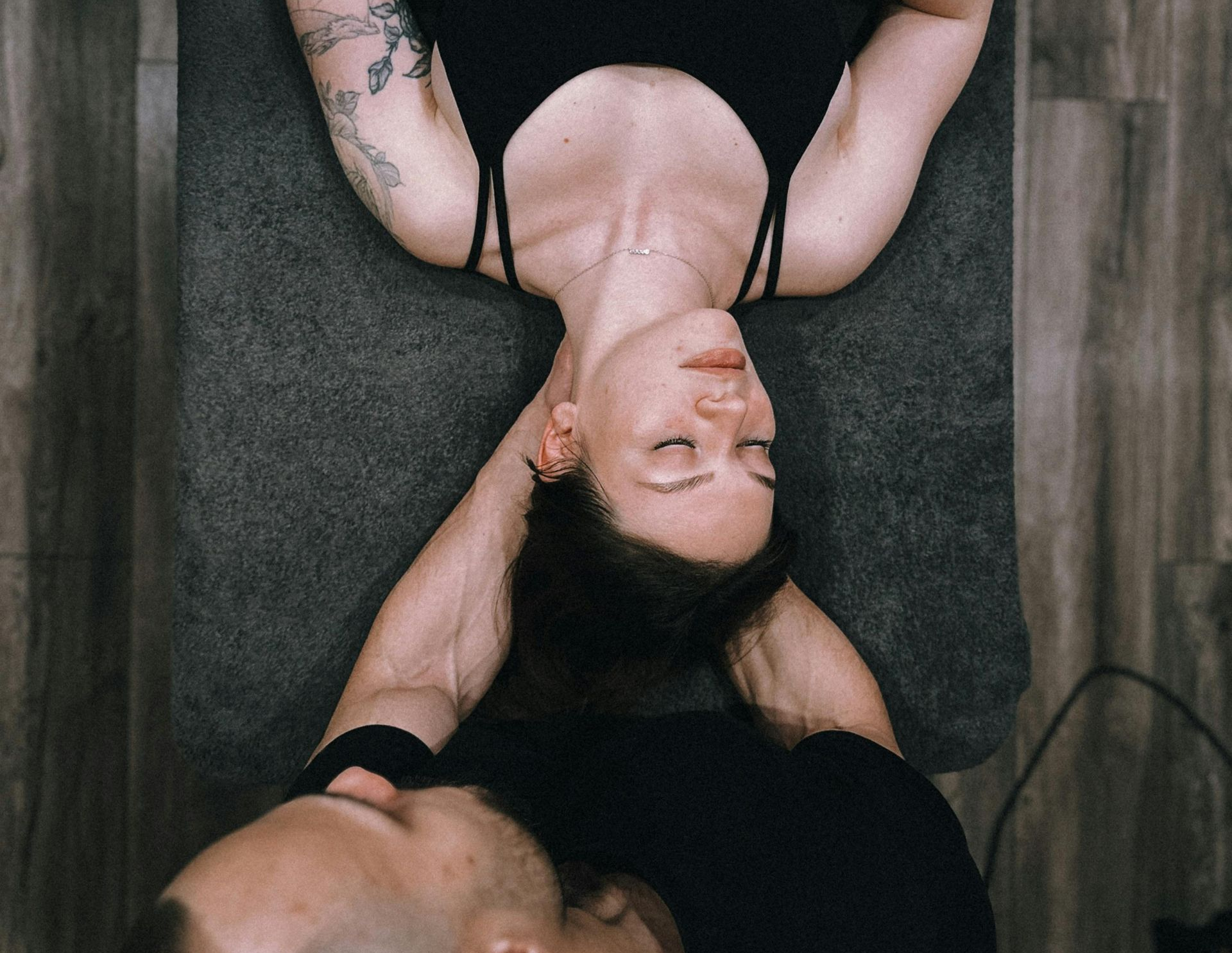 A woman is getting her wrist examined by a doctor.