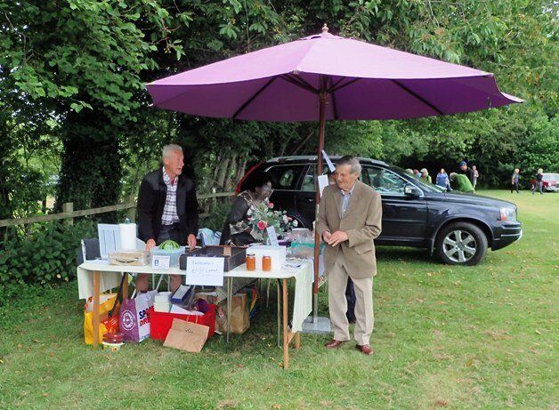 stall holders chatting at hampton bishop church fete