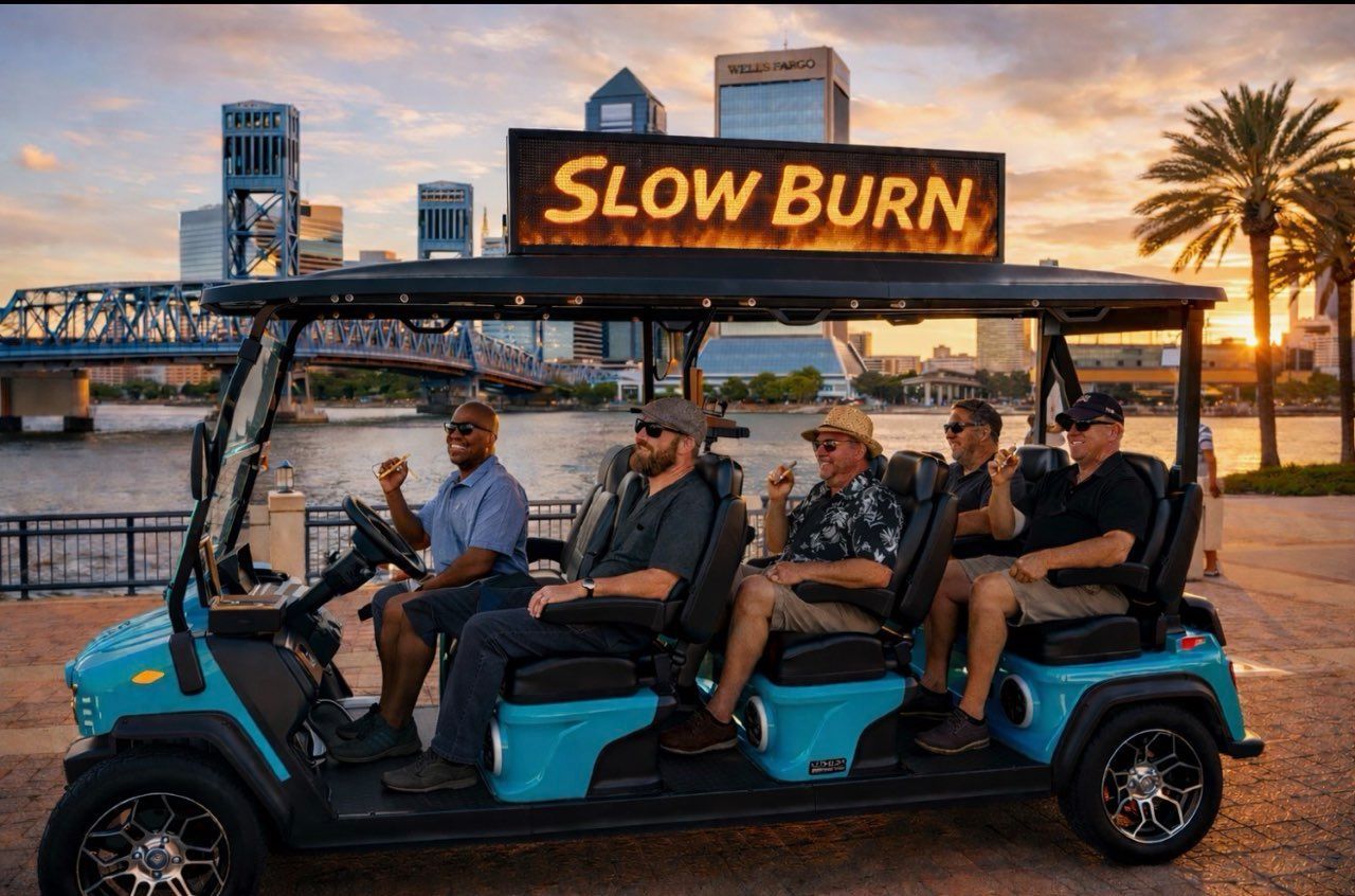 Five men in a blue golf cart with 