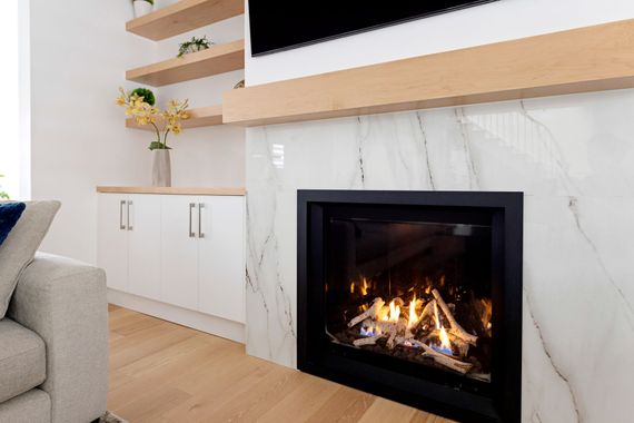 A living room with a fireplace and a couch.
