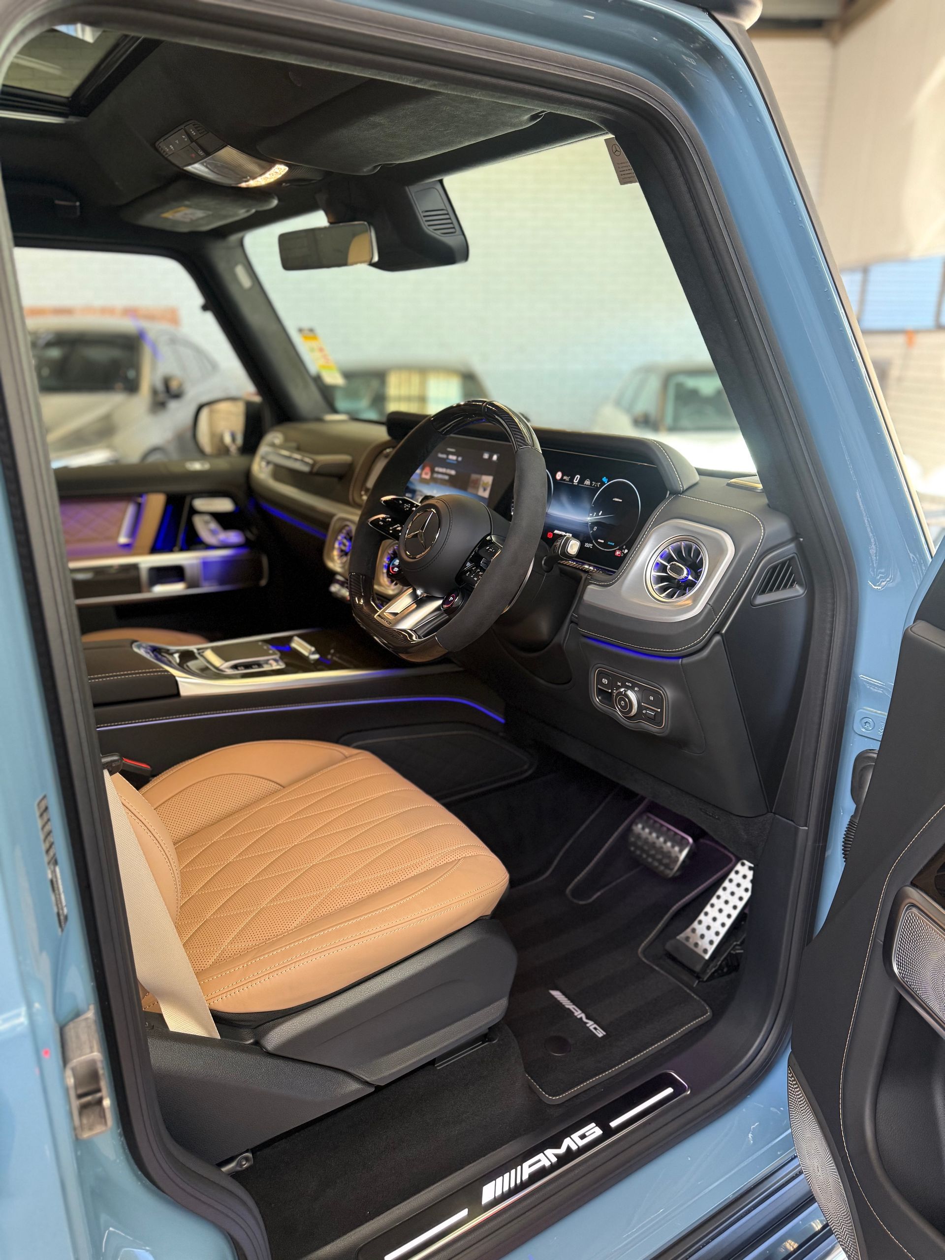 Mercedes-AMG G-Class interior with tan quilted leather seat.
