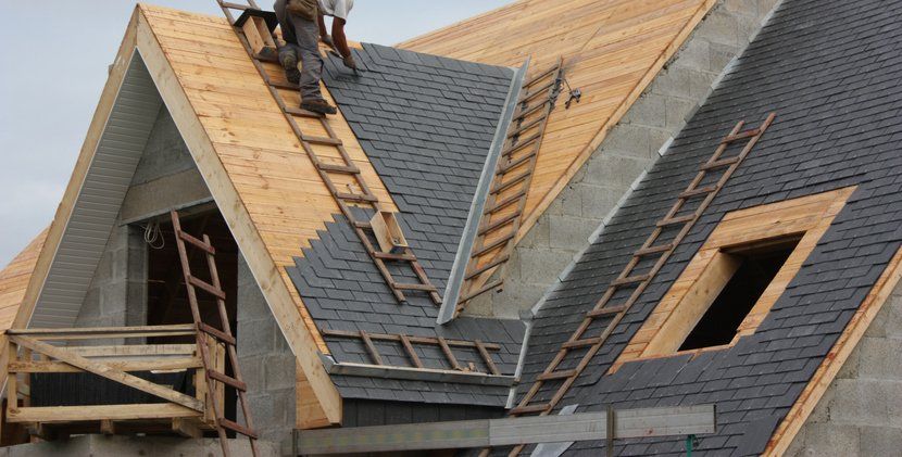 Roofer Roof in slate tiles Modern House