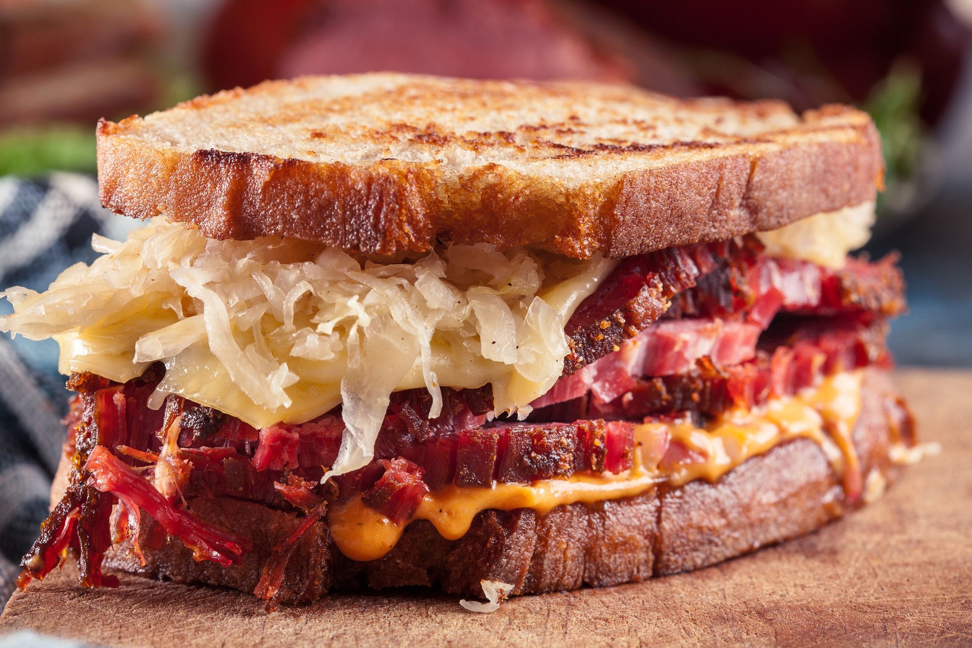 Reuben sandwich on toasted bread with corned beef, Swiss cheese, and sauerkraut.