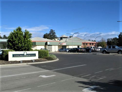 A parking lot with a sign that says general store