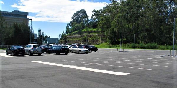 A parking lot with a lot of cars parked in it