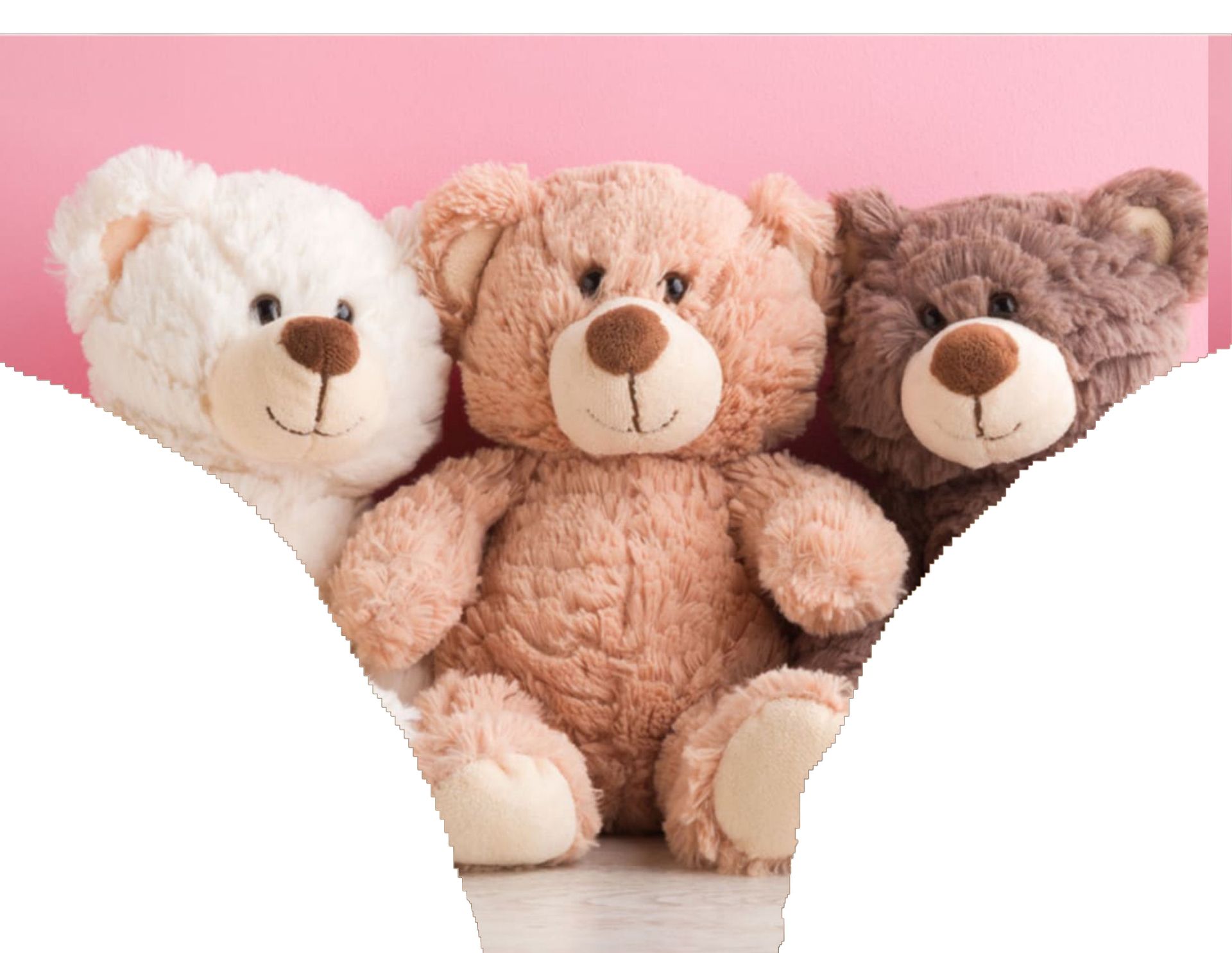 three teddy bears are sitting next to each other on a pink background .