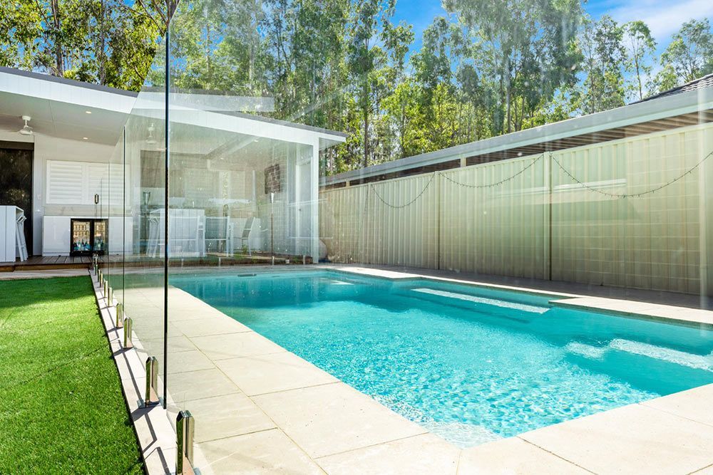 Residential Backyard Featuring a High Fence — Pool Installation in Newcastle, NSW
