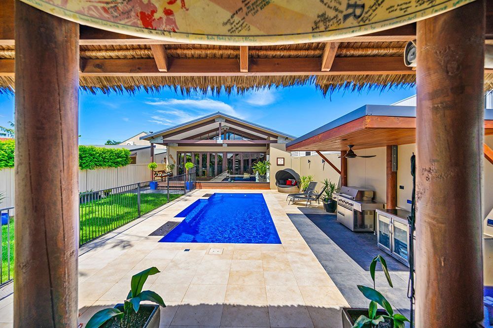 Spacious Backyard Featuring a Large Fibreglass Swimming Pool — Fibreglass Pools in Newcastle, NSW