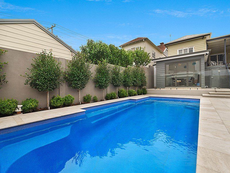 A Large Swimming Pool Surrounded By Trees — Swimming Pool in Scone, NSW