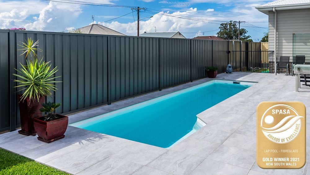 Inviting Swimming Pool Enclosed by a Spacious Fence — Self Cleaning Pool in Newcastle, NSW