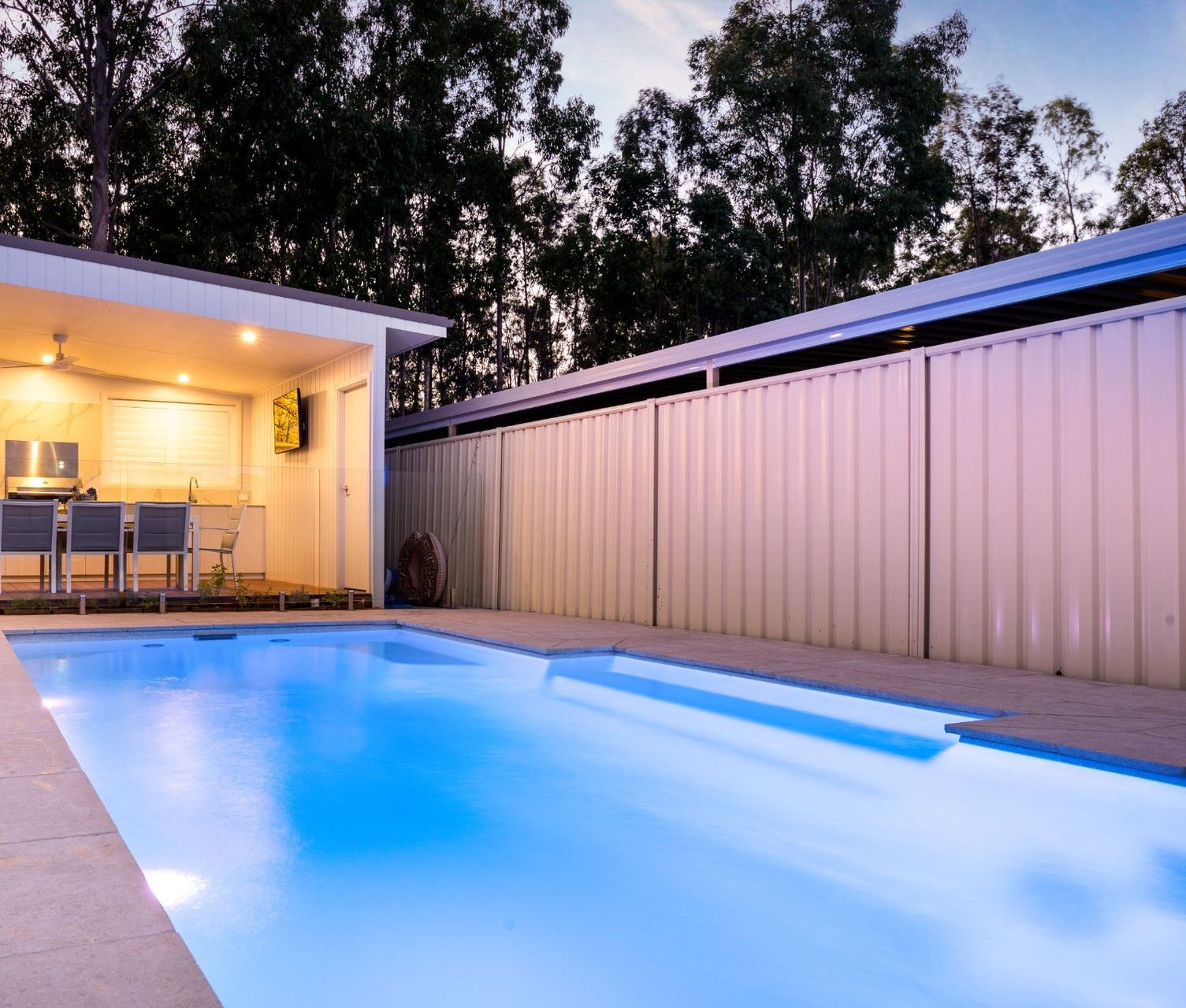 House with a Large Swimming Pool in The Evening— Swimming Pool in Cessnock, NSW