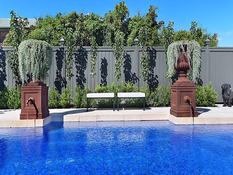 A Close Up Of A Swimming Pool With White Tiles On The Edge — Swimming Pool in Maitland, NSW