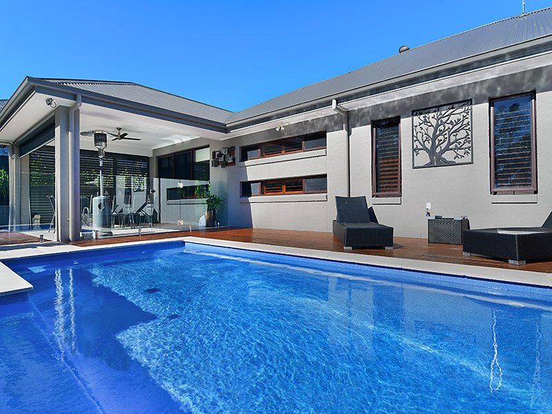 A Swimming Pool With Sun Lounges — Swimming Pool in Port Stephens, NSW